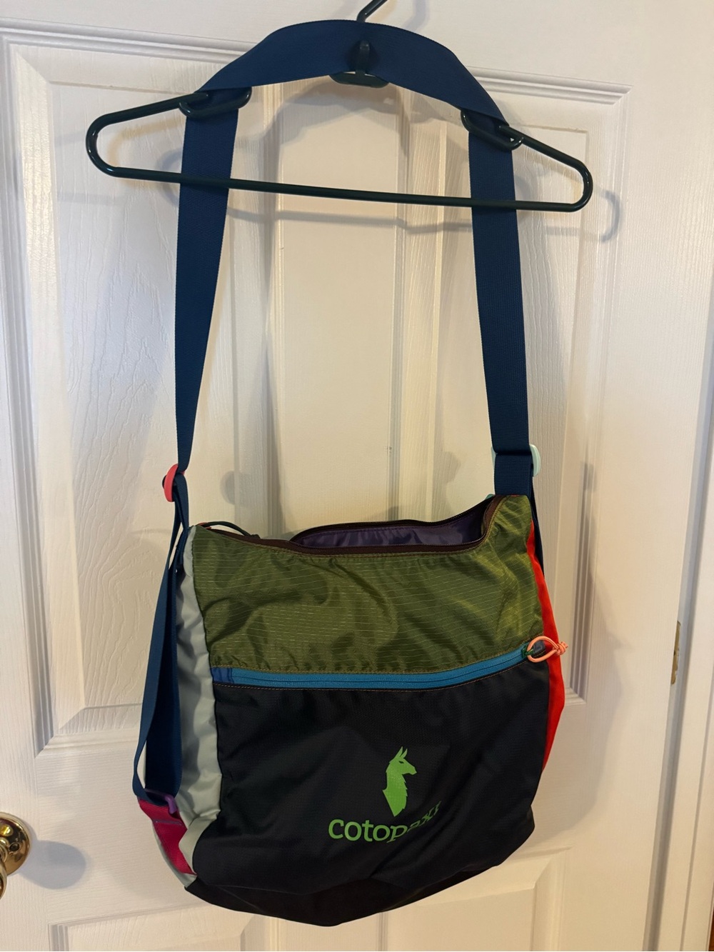 cotopaxi Multicolor Sling Bag with Blue Strap and Lime Logo
